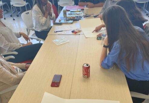 Team members engage in a creative brainstorming session during a team building event, fostering collaboration and innovative thinking.