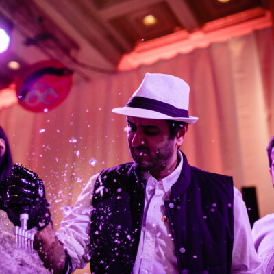A team collaborates to create an ice sculpture at a Team building Ice Sculpting event, using tools to carefully shape the frozen block into a masterpiece. thumbnail