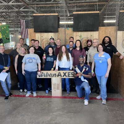 Team bonding at Urban Axes, where colleagues enjoy an exciting axe-throwing activity as part of their Mystery Bus team building adventure. thumbnail