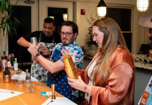 Team members shaking up cocktails during a mixology class. This fun and interactive team building event encourages collaboration, creativity, and the art of crafting delicious drinks.